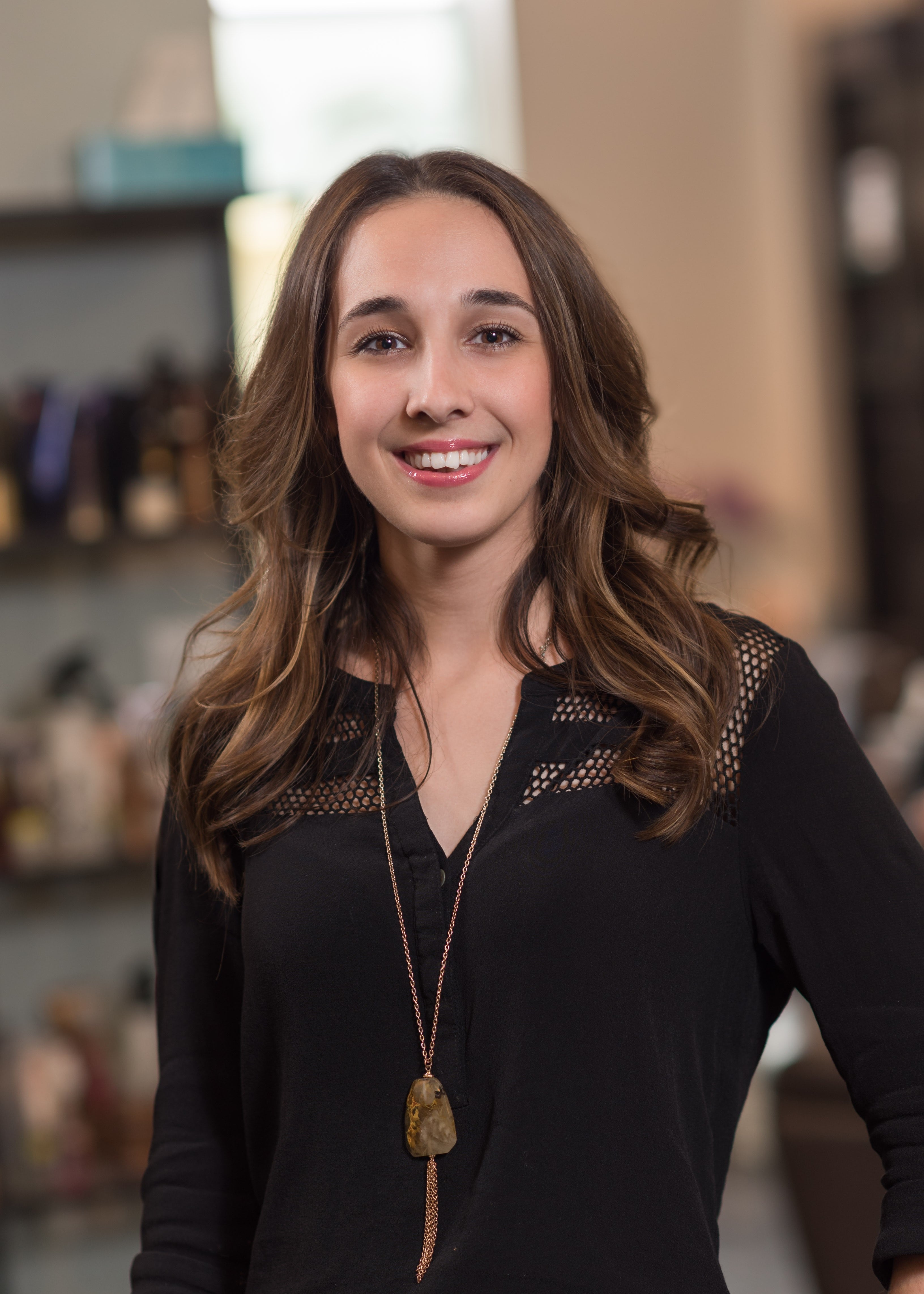 headshot of smiling salon manager