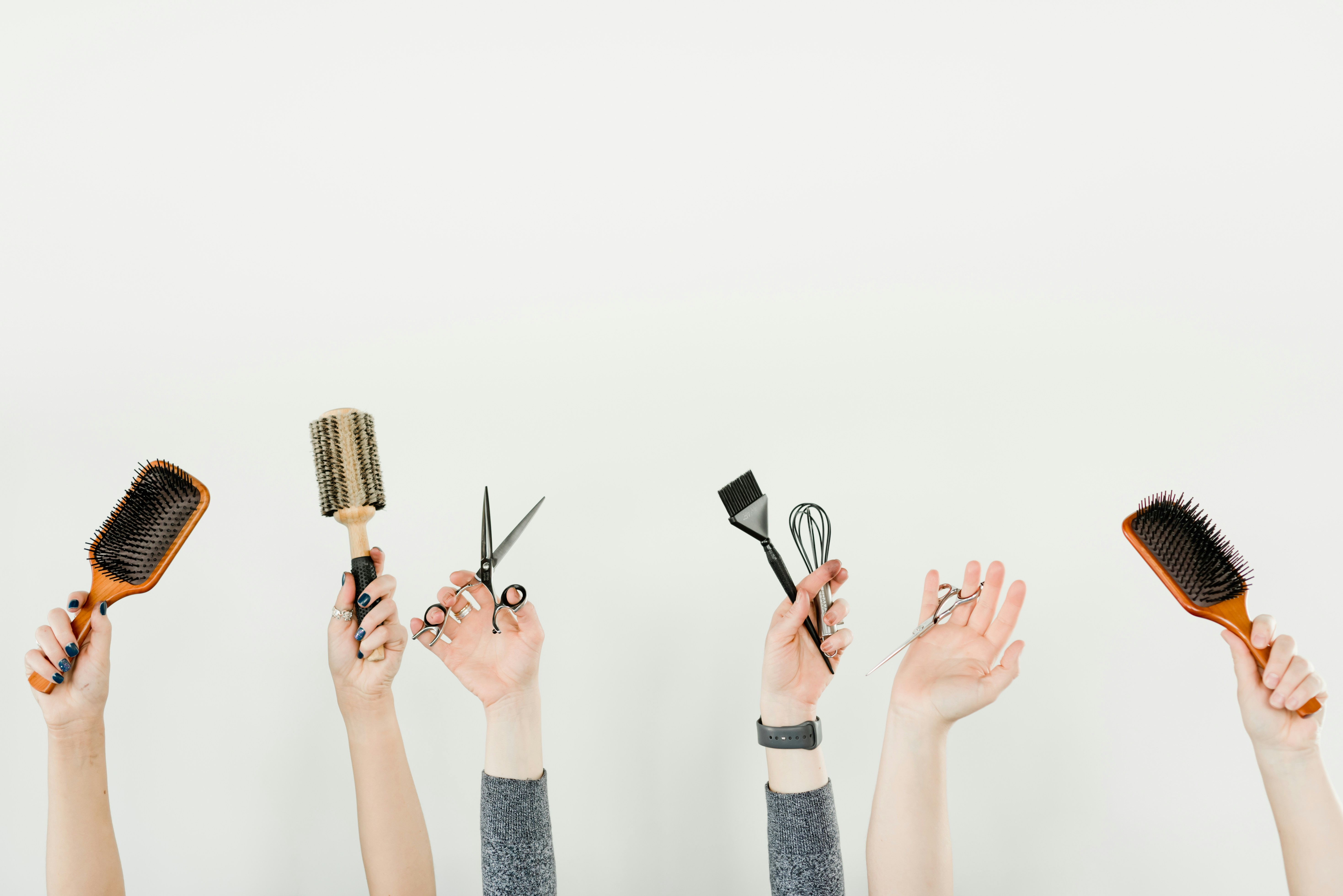 hand holding up salon tools